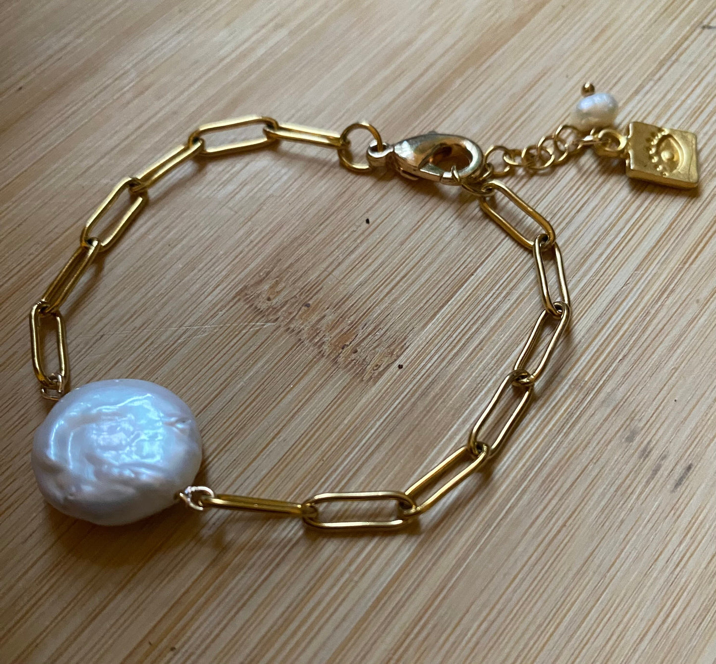 Freshwater natural pearl bracelet with golden Stainless steel chain , 18k gold plated evil eye pendant