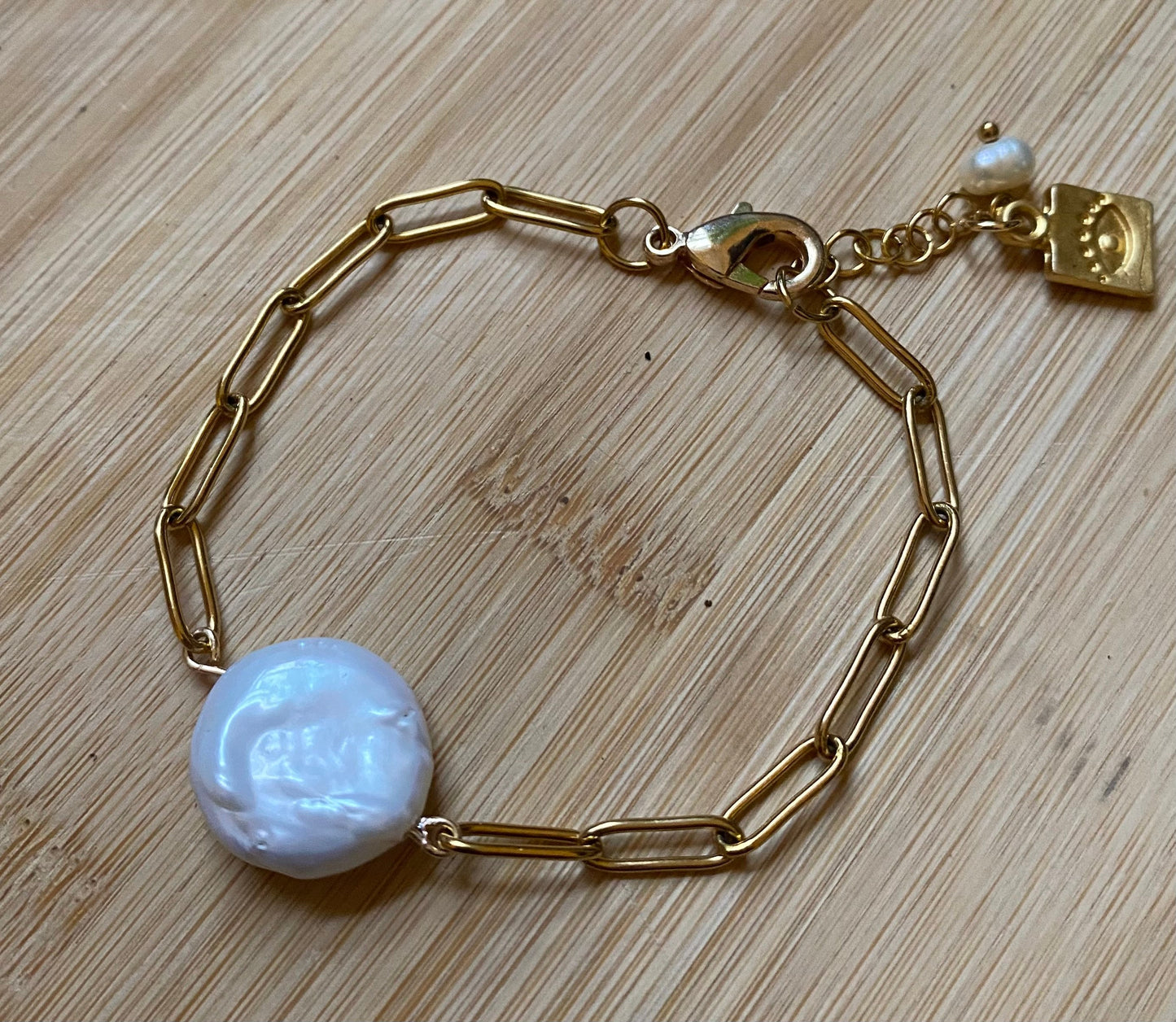 Freshwater natural pearl bracelet with golden Stainless steel chain , 18k gold plated evil eye pendant