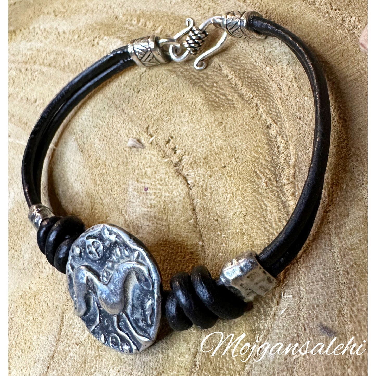 Celvic horse button bracelet with natural leather.