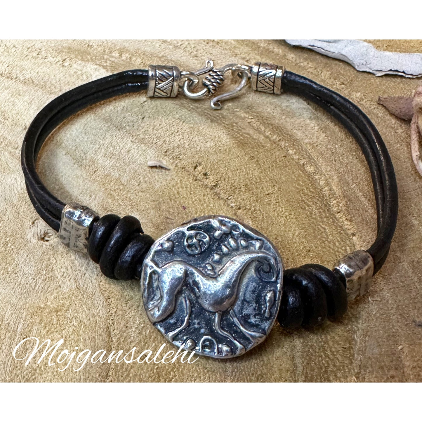 Celvic horse button bracelet with natural leather.